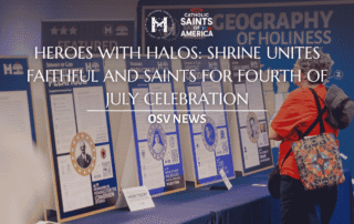 Lady looking at boards for Catholic Saints of America Event
